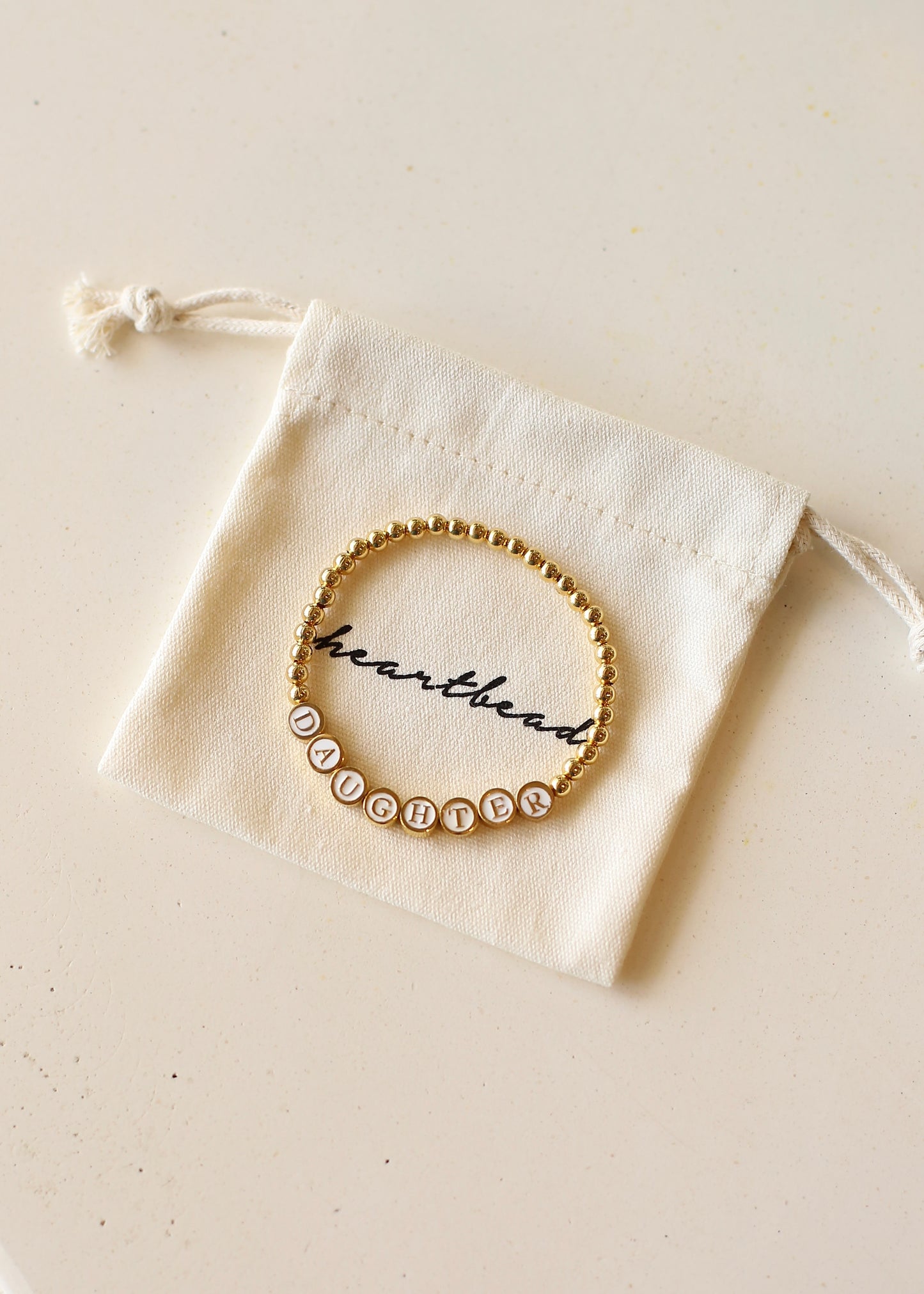 DAUGHTER goldbeaded bracelet